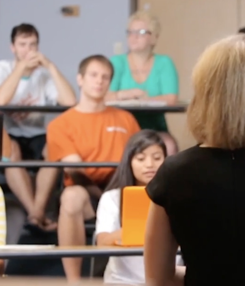 students listening to a professor lecture